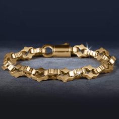 This bracelet is designed to be the perfect match to any outfit. Expertly crafted from premium grade stainless steel with a yellow gold finish. The ornately shaped links are meticulously designed, showcasing detailing that adds a touch of intricacy and luxury. A bracelet that exudes timeless elegance and sophistication. Luxury Stainless Steel Chain Bracelet With Rectangular Links, Luxury Stainless Steel Box Chain Bracelet, Luxury Gold Stainless Steel Chain Bracelet, Luxury Metal Box Chain Bracelet, Modern Gold Chain Bracelet With Polished Finish, Elegant Metal Gold Bracelet With Box Chain, Elegant Stainless Steel Chain Bracelet With Rectangular Links, Elegant Gold Box Chain Bracelet, Luxury Gold Chain Link Bracelet With Polished Finish