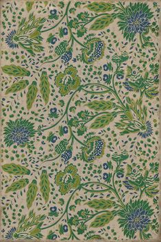 a green and blue floral design on a beige background