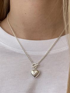 - Toggle closure- Heart pendantMeasurements- Length: 16.5- Pendant: 0.7*0.5Composition- Silver 925Designer- Made in Korea- by USUAL M.E- Style#: 300715784 Heart Pendant Toggle Necklace With Adjustable Chain, Elegant Silver Toggle Necklace With Heart Charm, Elegant Heart Toggle Necklace With Adjustable Chain, Gift Pendant Toggle Necklace, Elegant Heart Shaped Toggle Necklace With Adjustable Chain, Sterling Silver Heart Necklace For Everyday, Elegant Heart Pendant Toggle Necklace For Valentine's Day, Classic Sterling Silver Necklace With Toggle Clasp, Everyday Sterling Silver Heart Necklace