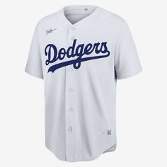 the los angeles dodgers'home jersey is shown in white and has blue lettering on it