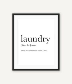 a framed black and white poster with the words laundry in cursive font on it