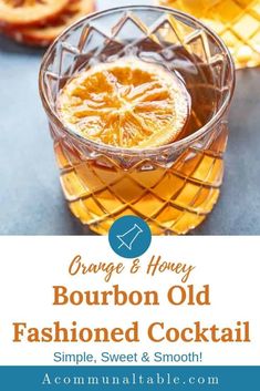 an orange and honey bourbon old fashioned cocktail in a glass with the words, orange & honey bourbon old fashioned cocktail