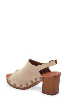 A center seam and large side studs detail a suede slingback sandal set on a wooden heel and platform for retro appeal. 3 1/4" heel; 1" platform (size 39) Leather upper and lining/synthetic sole Made in Italy Chic Suede Clogs With Wooden Heel, Chic Suede Clogs With Stacked Heel, Suede Clogs With Platform And Open Heel, Chic Open Heel Suede Clogs, Suede Slingback Sandals With Open Heel, Suede Heels With Wooden Heel, Chic Suede Sandals With Reinforced Heel, Chic Suede Sandals With Wooden Heel, Suede Heels With Wooden Open Heel