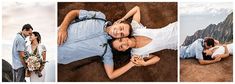 two people laying on the ground with mountains in the background