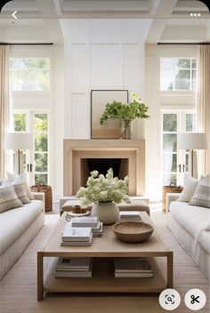 a living room filled with furniture and a fire place