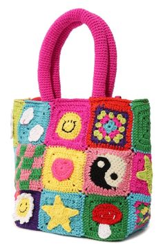 a crocheted bag with colorful patches and stars on the front, sitting on a white surface