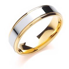 two tone gold and silver wedding ring on a white background with clipping path to the right