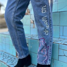 This Is The Second Pair Of Original Levi's In The 505 Style That I Have Included In The 'Dream On' Collection. These Have A Similar Fit To The Other 505's Listed, But They Have A Longer Leg, And A Slightly Lighter Denim Wash. I Have Embroidered The Left Leg With A Double Purple/Pink Flame, As Well As A White Thread Color For The Letters. Both Back Pockets Have The Purple Thread Emphasizing The Classic Levi's Pocket Seams! This Is An Amazing Piece For Those Of You Who Are Obsessed With Vtg Denim- These Are In Amazing Condition Considering They Have Been Worn Since The Early 90's! Listed As A Womens 12, But Vintage Sizing Can Vary Between Each Item. Waist 31, Inseam 31 Levis 505, Light Wash Denim, Light Denim, The Purple, Long Legs, Levis Jeans, Denim Wash, Blue Purple, Levi's