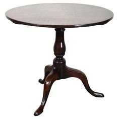 a wooden table with an oval top