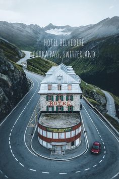 the hotel belveder is located on top of a mountain in europe and has a parking lot for cars