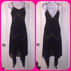 Never Worn. Black Dress With Gold Embroidery And Beads Overall. 100% Silk. "V" In The Front And Back. Fully Lined. Form Fitting With Flowy Bottom. Only A Few Beads Missing. Extra Beads Come In A Bag Attached To The Tag. Otherwise Perfect Condition. Zipper And Hook Closure On The Left Side. Tag Says Size 4 But Fits More Like A 2. Bundle Any 2 Items In This Closet To Receive 10% Off Plus Save On Shipping! Fitted Beaded Holiday Dress, Holiday Fitted Beaded Dresses, Beaded Fitted Dress For Holidays, Fitted Beaded Dresses For Holidays, Holiday Beaded Fitted Dress, Sleeveless Beaded Festive Dress, Beaded Sleeveless Festive Dress, Beaded Sleeveless Dress For Festive Occasions, Festive Black Beaded Dress