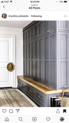 an image of a kitchen with gray cabinets and wood counter tops on the bottom shelf