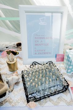 an old typewriter is sitting on a table next to some bottles and other items