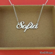 🌼 Order any name custom made on your small Sofia style nameplate necklace. 🌼 Made by me in solid sterling silver 925, both the nameplate and chain. Not plated! Genuine Solid Sterling Silver 🌼 Capital letter 7 mm tall, 1.2 upgraded nameplate gage 🌼 Choose your chain length and style in the menus, add the name or word in the Personalization Box provided --------------Shipping---------------- 🌿 I will make and ship your personalized necklace out to you within 4-7 business days. FREE STANDARD U Sofia Name, Sliver Necklace, Fancy Jewellery Designs, Nameplate Necklace, Fancy Jewellery, Necklace Sterling Silver, Personalized Necklace, Name Plate, Name Necklace