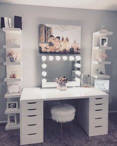 a white desk with drawers and a mirror