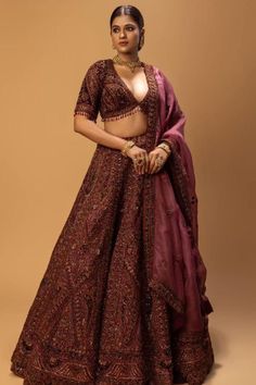 Step into the world of timeless beauty with our exquisite lehenga crafted from luxurious burgundy organza silk fabric. This masterpiece is adorned with intricate neem zari dori embroidery, adding a touch of traditional charm. The heavy zardose work of dabka and gitcha material brings unparalleled opulence, making this lehenga perfect for any grand celebration.  WhatsApp Call at +44(0)7807751166 or email us sale@onitaa.co.uk  #lehenga #lehengalove #organzasilk #burgundy #neemzari #traditionalwear #dabkawork #weddingwear #ordernow #onitaa #london Red Wine Lehenga Bridal, Burgundy Wedding Lehenga, Burgundy Lehenga Bridal, Burgundy Bridal Lehenga, Wine Colour Lehenga Bridal, Maroon Lehenga Brides, Dark Maroon Bridal Lehenga, Maroon Wedding Lehenga, Burgundy Lehenga