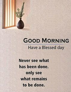 a vase sitting on top of a window sill next to a wall with the words good morning have a blessed day