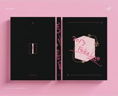 a black book with pink writing on the front and back cover that says it's fake love