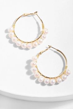 This season, pearls are a girlƒ??s best friend. the Freshwater Pearl Hoop Earrings feature an elegant display of freshwater pearls on a gold finished hoop. This classy piece is finished with a hinged hoop closure to secure feminine grace to your ensemble. Materials: Gold Plated, 7mm White Freshwater Pearl Size : 1.5" Diameter Hinge Hoop Imported Cheap Pearl Drop Dangle Hoop Earrings, Luxury White Pearl Hoop Earrings, Cheap Pearl Hoop Earrings, Cheap Pearl Drop Hoop Earrings, Cheap Pearl Hoop Earrings For Party, Cheap Hoop Pearl Drop Earrings, Cheap Pearl Hoop Earrings For Pierced Ears, Affordable Pearl Hoop Earrings For Weddings, Cheap White Pearl Hoop Earrings