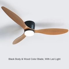 a black and wood ceiling fan with light on the blades is shown in this image