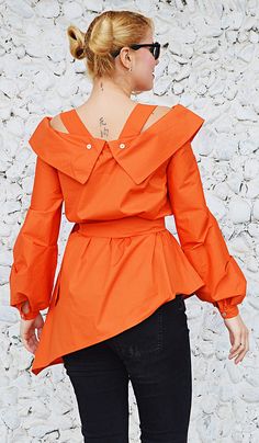 Orange cotton top with long sleeves.Bright wonderful orange tunic. Material 95%cotton, 5% elastane The model in the picture is size S. Can be made in ALL SIZES. If you have any other specific requirements, do not hesitate to contact me! I DO NOT CHARGE EXTRA MONEY for custom made items. All you need to do is send me your measurements. Below, you will find a table with size references. How to get an accurate measurement: * Chest: the circumference, measure the fullest part of your chest ( bra inc Orange Cotton Blouse For Work, Chic Orange Cotton Blouse, Spring Cotton Orange Blouse, Spring Orange Cotton Blouse, Fitted Long Sleeve Orange Top, Orange Long Sleeve Cotton Blouse, Orange Long Sleeve Blouse For Work, Fitted Orange Tops For Work, Chic Orange Long Sleeve Blouse