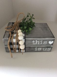 this is us box with candles and greenery