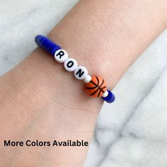 Sports Jewelry, Persaonlize sports bracelet lightweight and comfortable. Select your own color and personalize it with your team name, your name, or your jersey #.    The perfect giveaway for the team, grandkids, kids, party favors, birthdays and so much more. SEE SIMILAR ITEMS HERE: https://etsy.me/3ZxTGC0  💖ITEM DETAILS: Elastic band, Polymer Clay beads 💖BRACELET SIZING: Please refer to our last picture slide to see how to measure your beautiful bracelets (Please note: Drop-down menu size chart is estimated. Specific measurements will ensure a better fit for your custom order) 💖ALL ORDERS ARE FINAL.  These are custom jewelry made to order. Please be sure to DOUBLE CHECK all your spelling and color selections prior to checkout If you have any issues with your order, please feel free to Personalized Blue Bracelets For Game Day, Personalized Blue Bracelets For Sports Events, Blue Team Spirit Beaded Bracelets As Gift, Personalized White Wristband For Team Events, Personalized White Wristbands For Team Events, Blue Beaded Bracelets For Team Spirit Gift, Blue Adjustable Beaded Bracelets For Team Spirit, Adjustable White Wristband For Sports, Adjustable Team Spirit Bracelets With Letter Beads