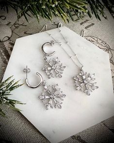 Silver Snowflake Earring, Snowflake Charm Necklace, winter jewelry, Crystal Snowflake Dangle Earrings, Christmas gift for her Sparkling snow flake Charm dangles off of Sterling silver Hoop earrings. Perfect earrings for this winter season. *Total length of the earring is approx. 35mm ---------------------------------------------------------------------- ** HOW TO TAKE CARE OF YOUR JEWELRY ** - Remove your jewelry when swimming, sunbathing ad showering - Keep them away from chemicals like perfumes, body creams & hairspray - Do not wear your jewelry while exercising - Use dry soft cotton cloth to clean once in a while ---------------------------------------------------------------------- We do the gift-wrapping for you. Perfect for gifting! Snowflake Shaped Jewelry With Matching Earrings For Gifts, Winter Gift Drop Earrings, Mountain Necklace Silver, Snow Flake Christmas, Sparkling Snow, Large Pearl Earrings, Snowflake Necklace, Crystal Snowflakes, Winter Jewelry