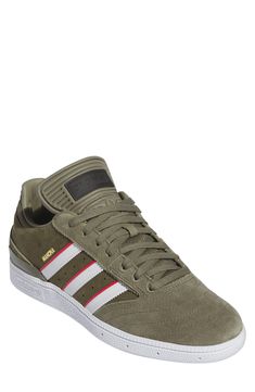 Sporting a timeless trio of stripes, this Dennis Busenitz signature street sneaker features a textured rubber sole and low-profile design. Lace-up style Adiprene sock liner Geofit anti-slip collar Leather upper/textile lining/rubber sole Imported Lace-up Skate Shoes With Three Stripes, Lace-up Three Stripes Skate Shoes, Urban Sneakers For Skateboarding With Three Stripes, Adidas Three Stripes Skateboarding Sneakers, Sporty Striped Low-top Sneakers, Sporty Striped Sneakers With Round Toe, Striped Sporty Sneakers With Round Toe, Striped Low-top Sneakers For Streetwear, Sporty Striped Sneakers For Streetwear