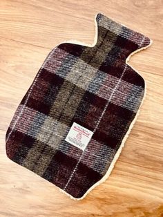 Handmade Harris tweed hot water bottle cover. Made with a Sherpa fleece backing to keep that bottle warm for a long time. I have personally test driven this design and my water bottle was still warm the next morning. If you're concerned about escalating heating costs then this could be the very thing for you. extremely tactile and comforting. Great gift for anyone with aches and pains. An excellent gift for the elderly, people who feel the cold, cold climates. Please note, I have not included a Water Bottle Case, Tweed Purse, Plaid Purse, Tweed Bag, Plaid Tote, Water Bottle Covers, Cosy Winter, Hot Water Bottle Cover, Elderly People