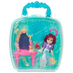 the little mermaid doll is in its plastic case and has a mirror on top of it