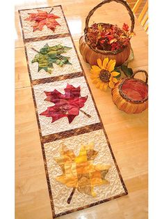 a table runner with autumn leaves on it