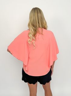 The coral winged sleeve top brings romance to your wardrobe! Its v neck and dramatic wide sleeves are complemented perfectly by its elbow length flutter winged sleeves, giving you a beautiful silhouette no matter how you choose to style it. Dare to be bold and make a statement! V neck Dramatic wide sleeves Elbow length flutter winged sleeves Full coverage under arm Available in plus True to size but straighter No stretch Modeled in size small Free shipping over $100. Pink Butterfly Sleeve Top For Spring, Pink Flutter Sleeve Top For Brunch, Pink Bell Sleeve Tops For Summer, Pink Batwing Sleeve Tops For Spring, Pink Butterfly Sleeve Blouse For Spring, Flowy Tops With Butterfly Sleeves For Brunch, Chic Pink V-neck Top For Spring, Pink Flutter Sleeve Blouse For Brunch, Elegant Flowy Top With Butterfly Sleeves