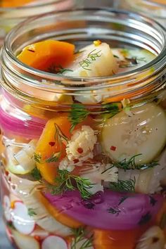 a jar filled with lots of different types of vegetables