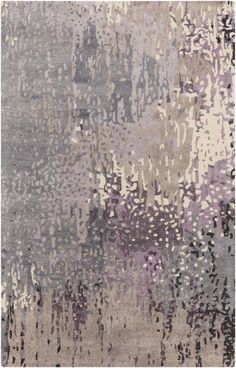 an area rug with various colors and patterns on it, including grays and purples