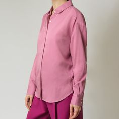 A relaxed fit that works on its own but still fits comfortably under a jacket. Made from drapey tencel fabric with a slight drop shoulder but tailored details like a covered placket, button cuffs and a curved shirt tail keep this button up shirt feeling modern and sophisticated. The rounded collar offers a feminine finishing touch. Wear tucked or untucked. 100% Tencel Oversized Blouse For Business Casual In Spring, Oversized Blouse For Business Casual, Tencel Blouse For Workwear, Tencel Workwear Blouse, Spring Viscose Shirt With Relaxed Fit, Versatile Relaxed Fit Shirt With Button Cuffs, Spring Tops With Button Closure And Straight Hem, Spring Tops With Concealed Placket For Business Casual, Spring Business Casual Tops With Concealed Placket