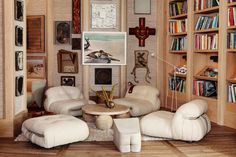 a living room filled with furniture and bookshelves covered in shelves full of books