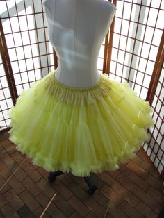 "This listing is for a custom version of the pictured super-full double layer nylon chiffon pettiskirt with satin waist. The pictured pettiskirt was designed for a 35.5\" (90cm) waist and is 19.75\" (50cm) long. It is displayed on a dress form with a 22\" (56cm) waist -- the pettiskirt is pinned in the back to prevent it falling off the dress form ;) You can choose any length up to 25\" (63,5cm) long. I will lengthen the tiers to achieve a longer length. The \"look\" of the pettiskirt becomes mo Fitted Organza Petticoat For Spring, Fitted Spring Organza Petticoat, Fitted Ruffled Skirt Petticoat For Dance, Spring Fitted Organza Petticoat, Fitted Organza Skirt With Attached Cancan, Fitted Tulle Petticoat For Summer, Fitted Ruffled Petticoat For Dance, Fitted Tulle Petticoat For Spring, Summer Dance Fitted Petticoat