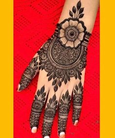 henna tattoo on the left hand and right hand with flower designs on it, which is