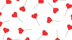 red hearts and pins on a white background