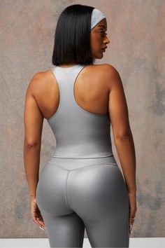 Anywhere Shine Built-In Bra Tank Fabletics Gunmetal Grey Shine female Activewear >> Womens >> Tops >> Tanks regular Training Metallic Fitted Workout Activewear, Metallic Fitted Athleisure Activewear, Metallic Stretch Activewear For Sports, Metallic Fitted Gym Activewear, Metallic Fitted Activewear For Sports, Sporty Metallic Activewear For Sports, Silver Stretch Activewear For Athleisure, Silver Stretch Athleisure Activewear, Fitted Silver Activewear For Sports