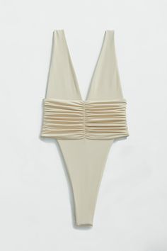 Our best-selling one-piece swimsuit in brand new shades! Equal parts sophisticated and sexy, the Echo One-Piece hugs your body and highlights your hips with a high-legged cut and minimal back coverage. The ruched side detail is met by moderate bust coverage and supportive shoulder straps. Super soft and super stretchy, this one-piece doubles as a bodysuit for an effortless beach-to-bar look. Just like an echo, you will want to repeat this purchase in every shade. Product description Minimal cove Cheap White Fun Swimwear, Cut Out Bathing Suits, Neutral Swimwear, Bridal Swimsuit, Cute One Piece Bathing Suits, Sophisticated Swimwear, Vacation Swimsuit, Christmas Cruise, Tie Swimsuit