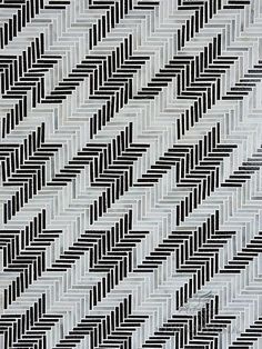 a black and white pattern on fabric that looks like herringbones or chevron lines