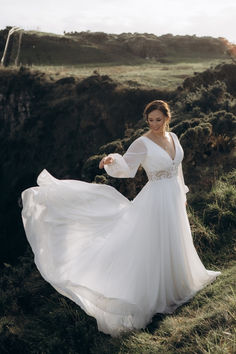 This dreamy 70s-inspired bridal look combines the fluid elegance of chiffon with a sweet lacy waistline for a timeless, free-spirited vibe. #70sBridalStyle #ChiffonGown #LaceWaistline #VintageBride #BohoBride Wilderly Bride, Fluid Fashion, Boho Shops, Allure Bridal, Bridal Look, Vintage Bride, Chiffon Gown, Line Shopping, Plus Size Shopping