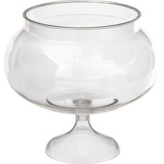 a clear glass bowl sitting on top of a table