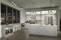 a large kitchen with lots of white cabinets and counter top space in front of windows