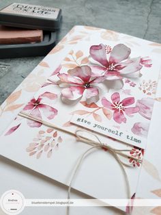 a close up of a card with flowers on it