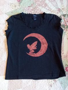 Here is a one-of-a-kind hand-stenciled T-shirt, that I call my Fairy Moon. My goal is to reuse/repurpose unwanted items, thereby reducing waste. To that end, my shirts were rescued from a thrift shop & given new life with stencils & bleach. The technique I used for this one was Soft Scrub with Bleach, painted onto a hand-cut stencil. Note:  When dark colors are bleached, you never know what you're going to get. Please refer to the pictures for individual colors. (Black usually bleaches to orange for some reason) This T-shirt is prewashed, preshrunk, in a Ladies Medium. The brand is GAP Stretch, & it has a ruffled neckline & sleeves. Diy Shirt Design Ideas, Custom Bleach Shirts, Screen Print T Shirt, Bleach Dye Shirts Diy, Bleach Painting Jeans, Bleach Shirt Design Ideas, Cute Bleached Shirts, Drawing On Shirt Ideas, Shirt Bleaching Techniques