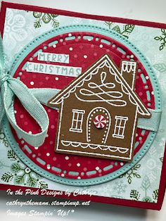 a handmade christmas card with a gingerbread house on it and a ribbon tied around the edge