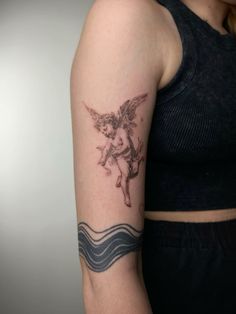 a woman with a tattoo on her arm